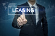 © tonefotografia - Businessman hand touching LEASING  button on virtual screen
