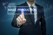 © tonefotografia - Businessman hand touching MASS PRODUCTION  button on virtual scr
