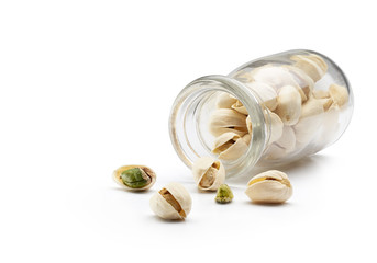 Poster - Pistachio Nuts Pouring Out From Bottle