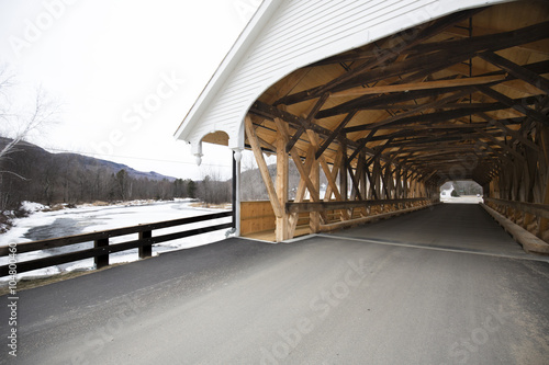 Fotografie, Obraz Entrance to historic white covered bridge, Stark, New Hampshire.