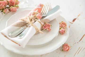 romantic table setting with died flowers
