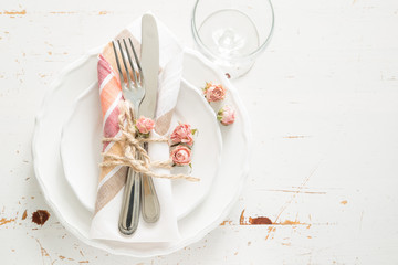 romantic table setting with died flowers