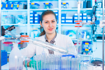 Wall Mural - Young woman in chemical lab