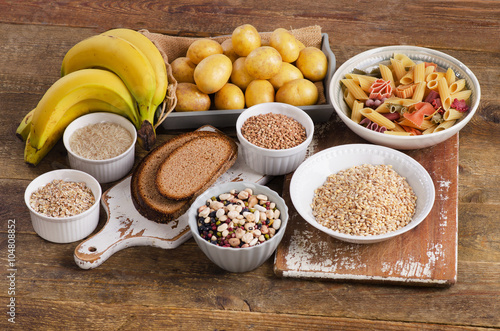 Cuadros en Lienzo Foods high in carbohydrate on wooden background.