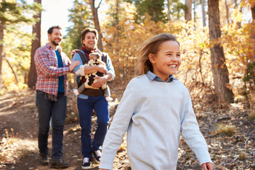 Wall Mural - Gay Male Couple With Children Walking Through Fall Woodland