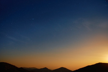 Wall Mural - Sunset over blue dark night sky