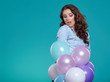 © ZoomTeam - Young pretty woman with colored balloons