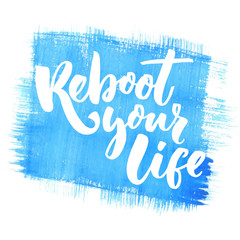 Reboot your life. Inspirational quote for motivational posters, cards and t-shirts. Black brush lettering on blue watercolor texture background.