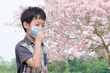 © gamelover - Asian boy have allergy from flower pollen