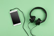  phablet and headphones on the color background