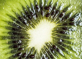 Slice of kiwi macro background texture.