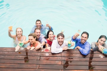 Wall Mural - Happy young friends having drinks