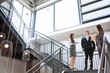 © WavebreakMediaMicro - Three executives standing on a staircase