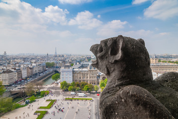 Chimera of Notre Dame Cathedral in Paris, France. Focus on statue