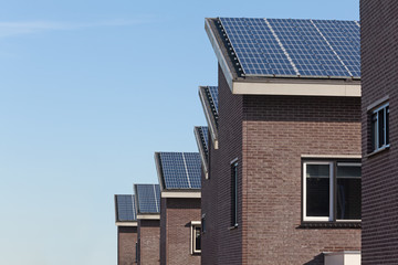 Wall Mural - Family house with solar panels for alternative energy