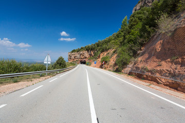 Rural road among rocks at summer