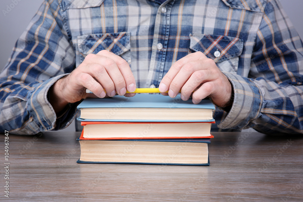 Man working with books, close up