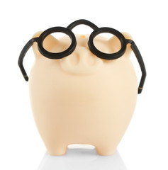 Poster - Piggy bank in glasses isolated on white