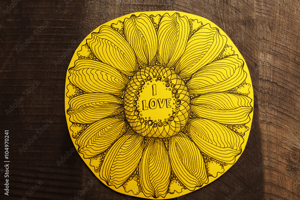 Yellow Valentine with inscription on wooden background