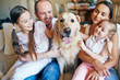 © pressmaster - Family with dog