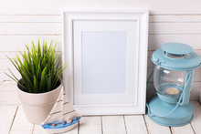 White Empty Frame And  Ocean Theme Decorations On White Wooden B