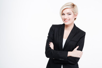 Happy businesswoman standing with arms folded