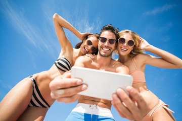 Happy friends having fun on beach 