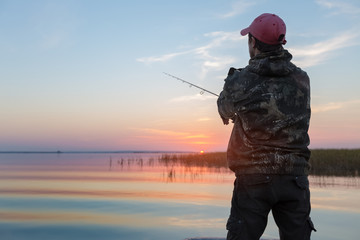 Wall Mural - Man fishing on the lake