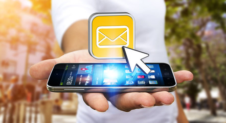 Young man using modern mobile phone to send message