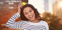 Composite Image Of Smiling Asian Woman With Paper Crown