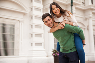 cute girl piggybacking her boyfriend