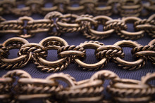 Gorgeous Antique Gold Rope & Oval Link Chains On Vibrant Purple Background In Selective Focus