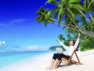 Wall Mural - Businessman Relaxing Idyllic Palm Fringed Beach Concept