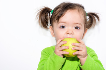  Little girl eating an apple