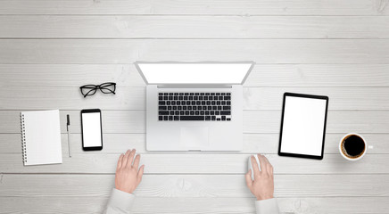 Poster - Responsive devices with isolated screen for mockup. Top view of modern desk with laptop, phone and tablet. Keyboard, coffee, glasses, notebook, pencil on table. 