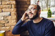 © sushytska - Handsome Man In Jeans Talking On Mobile Phone in Cafe Bar
