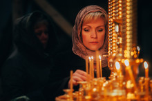 Christian Russian Woman With Candle In Orthodox Russian Church