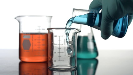 pouring liquid in science beaker