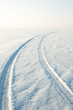 snow desert and the tracks of the car in the snow