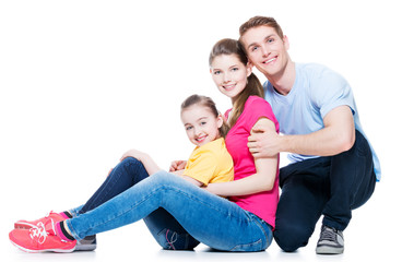 Wall Mural - Happy young family with kid sitting.