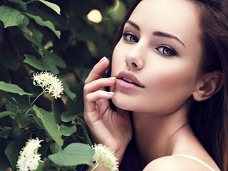 portrait of the young beautiful woman with long hairs. outdoors