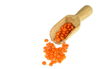 Wall Mural - Red lentils in wooden scoop isolated on white background