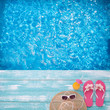 © missty - Blue sea. Fashion accessories summer flip flops, hat, sunglasses on bright turquoise board near the pool
