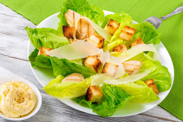 Caesarsalad with lettuce, croutons and grilled chicken breast, c