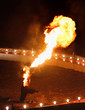 Fire Breather Circus Flame Show. Large Plume Of Flame