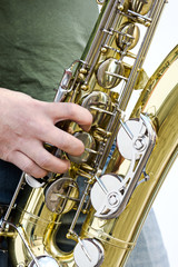 Wall Mural - men playing saxophone closeup