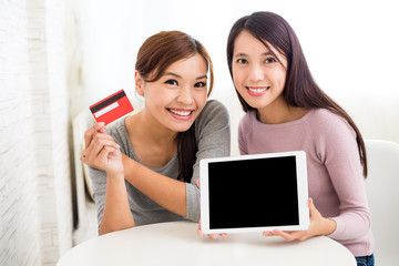 Woman online shopping with tablet pc and credit card