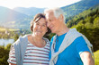 canvas print picture - sweet senior couple hugging in nature