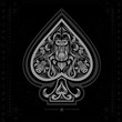 ace of spades with flower pattern inside. white in black