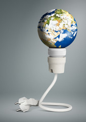 clean energy concept, light bulb with planet Earth and plug